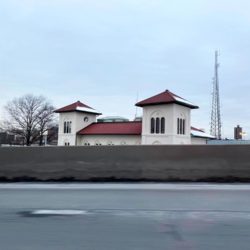 The old New York, Westchester, and Boston station obscured by the highway