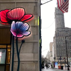 A decorative flower display on a shop along 5th Avenue